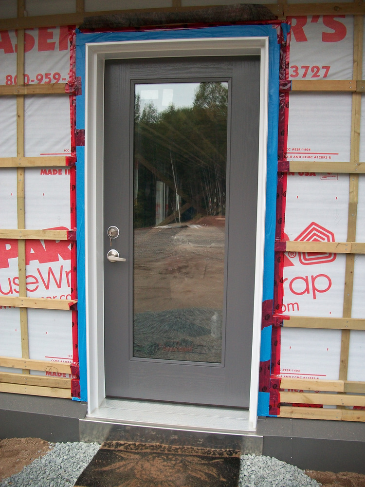 Entry door, painted roof grey, Blueskinned, Tuck taped and finally locked.