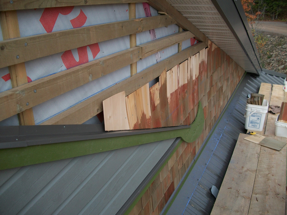 Eastern white cedar shingles @ 5" to the weather, set shanty style with a 3/8" up and down layering.